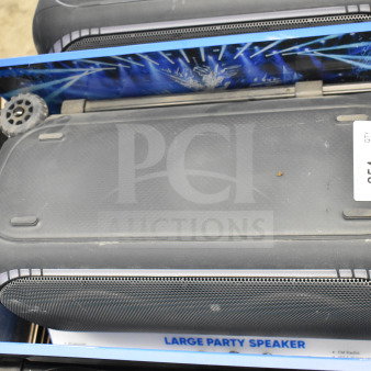 4 Onn Large Party Speakers in store display; black, rectangular design with mesh grill. Label indicates "QTY 4".