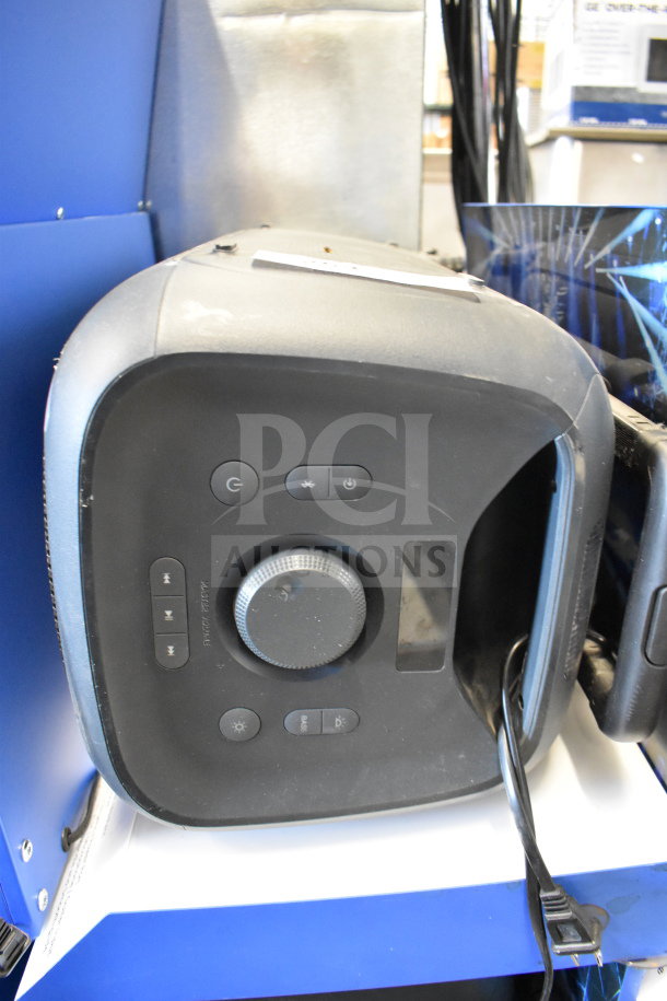 Onn Large Party Speaker with control panel, power buttons, and volume knob. Used condition on store display.