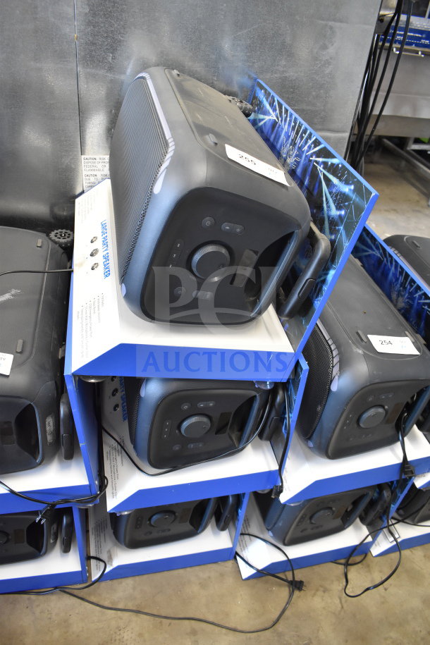 3 Onn large party speakers on display shelves, new condition, black with control panel, labeled "Large Party Speaker."