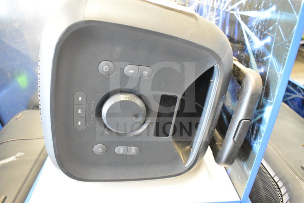 Onn Large Party Speaker with control panel and carrying handle. In-store display model, features multiple controls.
