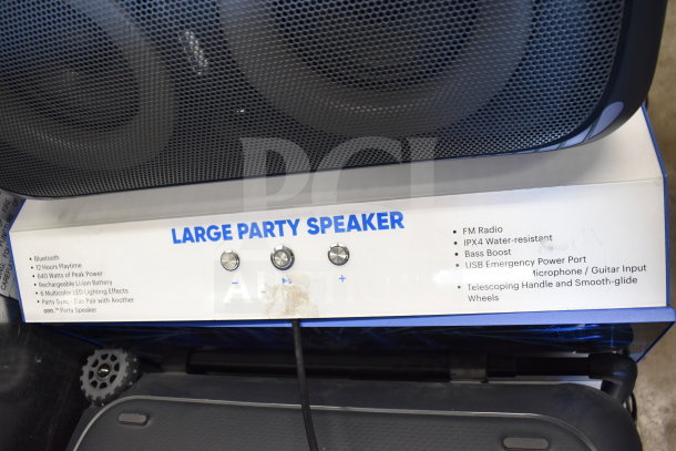 Onn Large Party Speaker display with features listed: Bluetooth, 640W power, IPX4 water-resistance, mic/guitar input, and wheels.