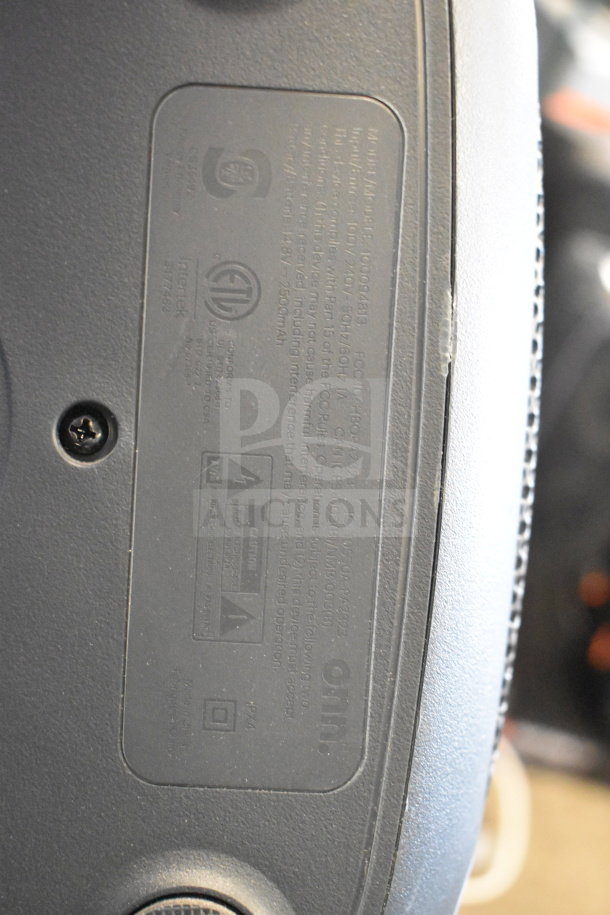 Onn Large Party Speaker label, model B0009AB1, electrical specifications, regulatory certifications visible on black background.