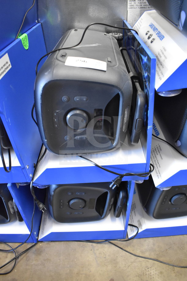2 Onn Large Party Speakers in display boxes, top controls visible, power cords attached; new condition, auction label present.
