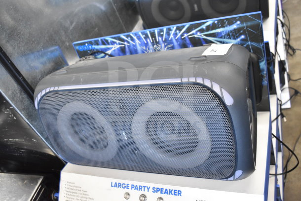 Onn Large Party Speaker, store display model. Features Bluetooth, 12-hour playtime, rechargeable battery. Condition: displayed.