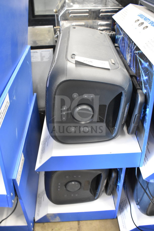 2 Onn large party speakers on display shelves, featuring control panel and robust design. Ideal for events, good condition.