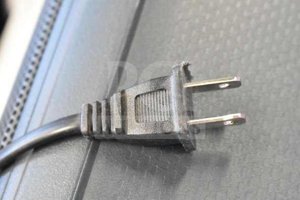 Damaged power cord plug on a display piece; part of auction lot featuring Onn Medium Party Speaker.