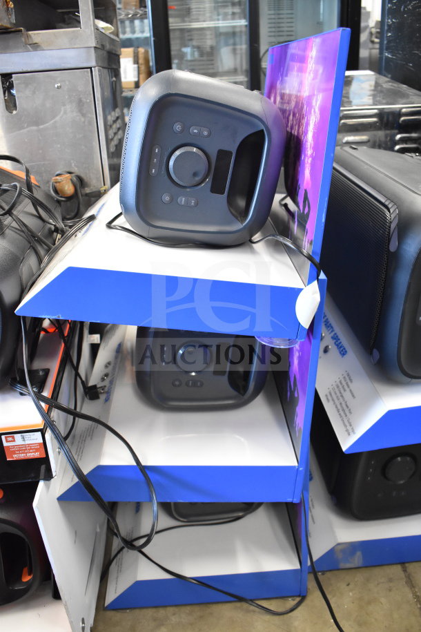 3-tier display with three Onn Medium Party Speakers, black, control panel visible, good condition, wires included.