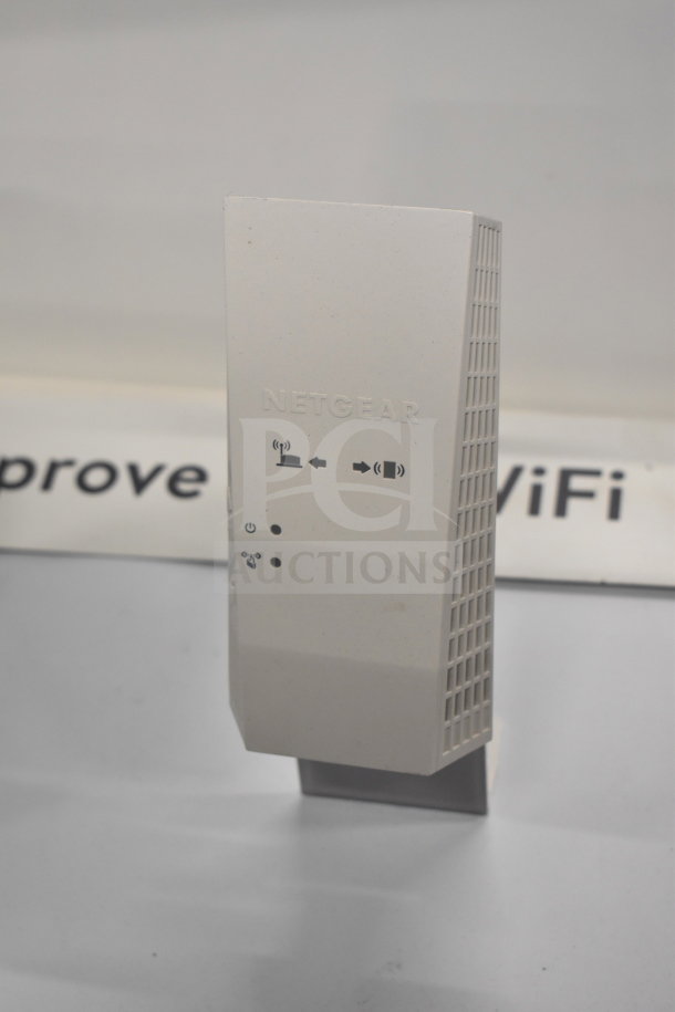 Netgear router display model. White unit with connectivity icons. Ideal for tech store display setup.