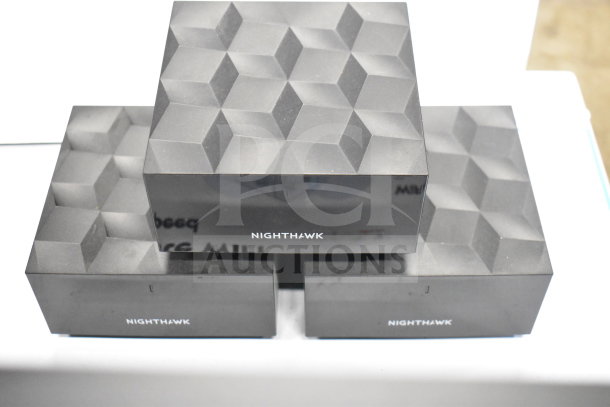 Nighthawk routers store display, featuring a geometric design, no visible damage, branded with "NIGHTHAWK" logo.