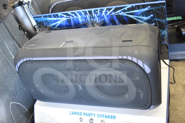 Onn Large Party Speaker on display stand, black with LED accents. Features Bluetooth, 640W power, rechargeable battery. Good condition.