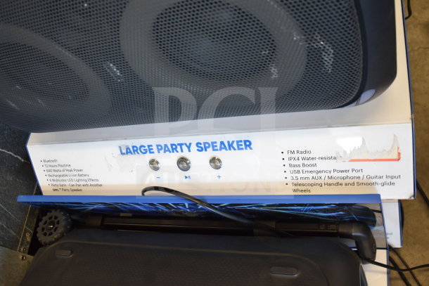 Onn Large Party Speaker with store display, featuring Bluetooth, 12-hour playtime, 640W peak power, and IPX4 water resistance.