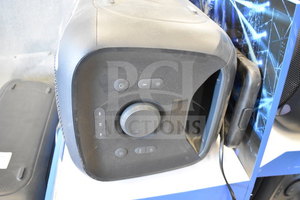 Onn Large Party Speaker on store display, featuring control panel with power, volume, and lighting buttons; minimal wear visible.