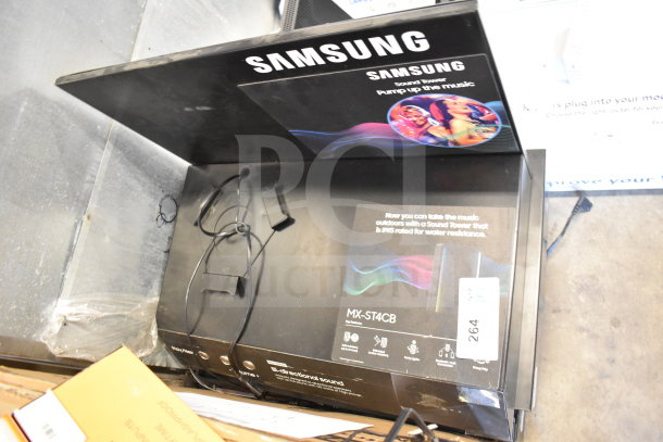 Samsung store display for MX-ST4CB model, featuring sound tower with water resistance. Includes wiring, marked “Pump up the music.”