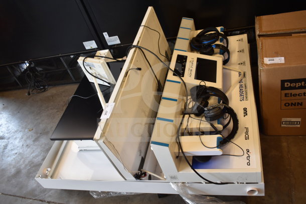 Store display with monitor, Turtle Beach headphones, displaying brands like Rig and Astro. Slightly used condition.