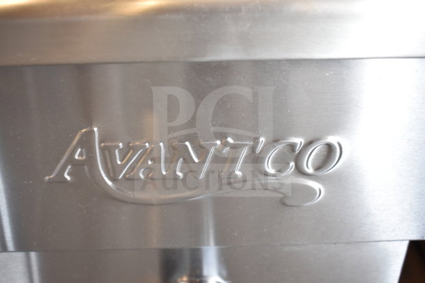 "Avantco" logo embossed on stainless steel surface of a brand new countertop fryer. Scratch and dent model.