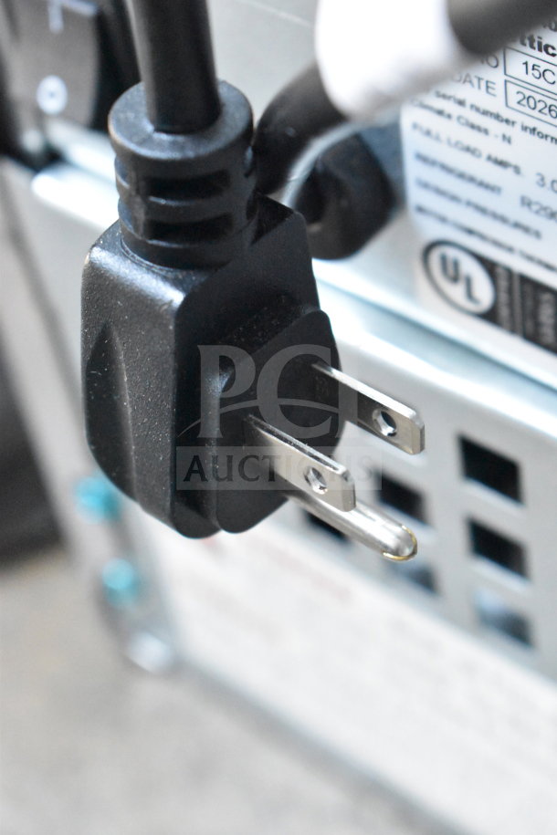 Close-up of power plug on a Follett 15CI114A-IW-NF-ST-00 countertop ice maker. Label shows UL certification.