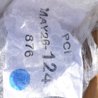 Plastic-wrapped pallet marked "MAY26-124." Contains 27 new scratch and dent items like plates, cutlery, trays, and cups.