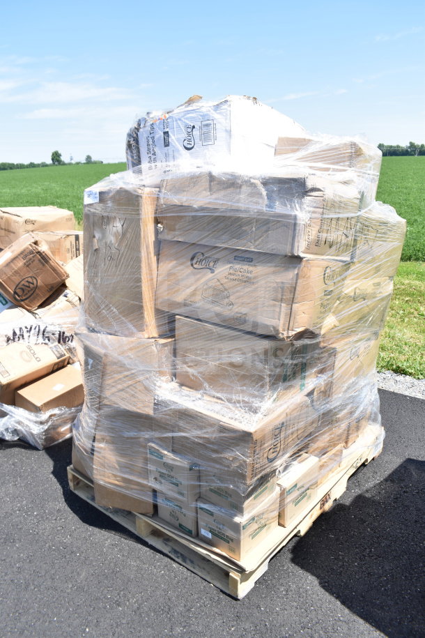 Pallet of scratch and dent items boxed, including cup sleeves, plates, and boba straws, wrapped in plastic film.
