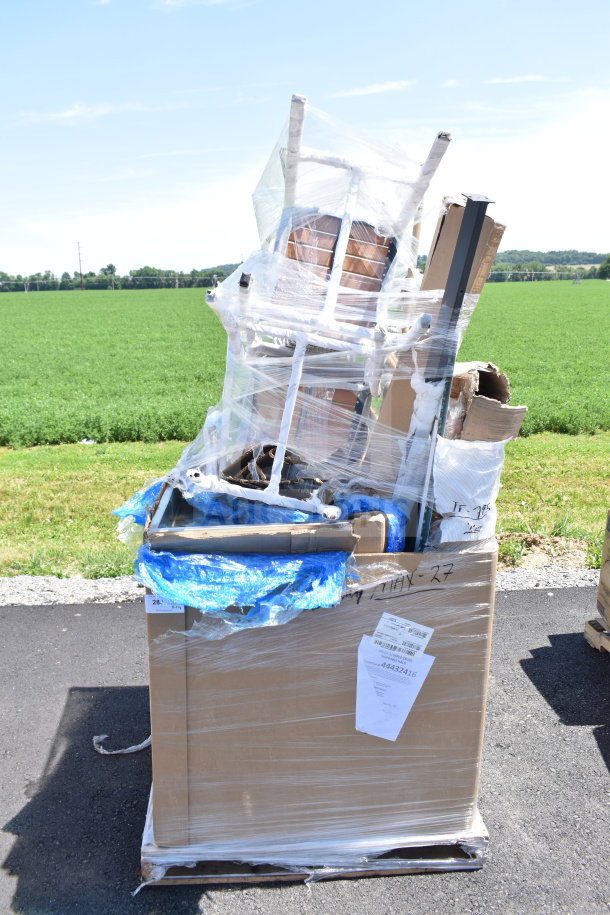 Pallet of 11 new scratch and dent items, including chairs, wrapped in plastic and cardboard. Tags with item details attached.