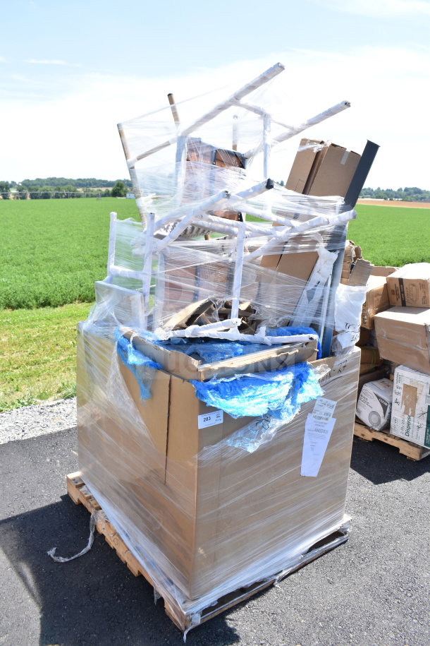 Pallet of 11 brand new scratch and dent items, including chairs, wrapped in plastic. Labels indicate auction lot 283.