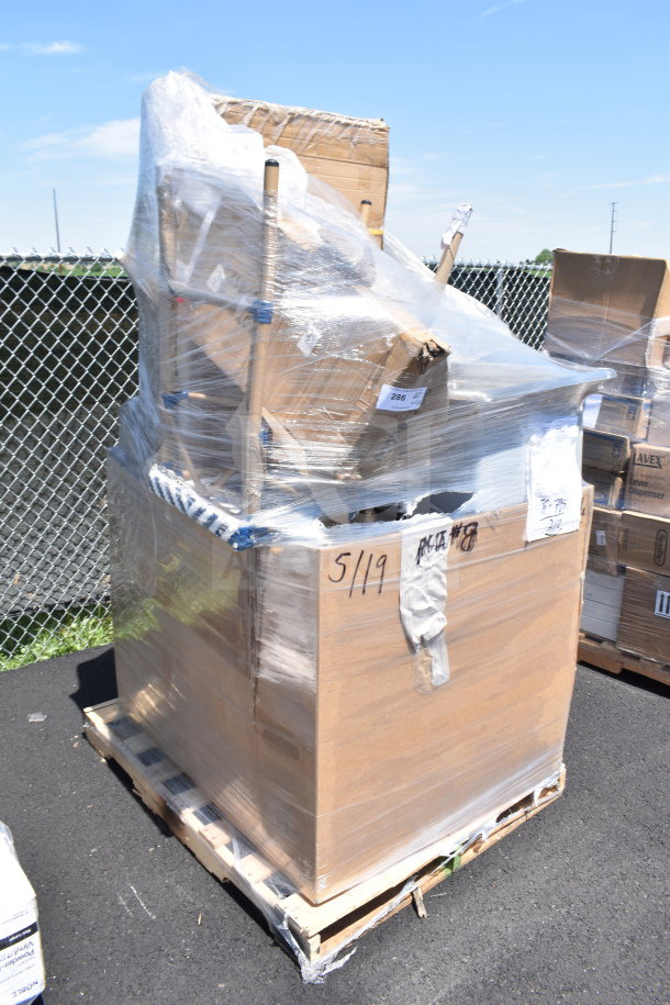 Plastic-wrapped pallet with 11 brand new scratch and dent items, including a chair and dish dolly, condition noted on boxes.