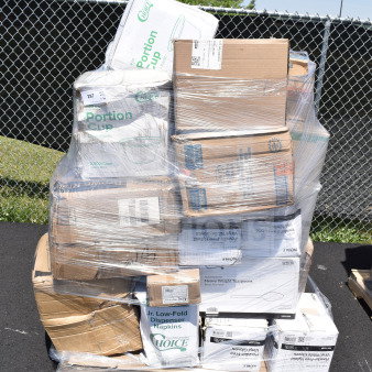 Palette of 31 brand new scratch and dent items, including gloves, napkins, and portion cups, in original packaging.