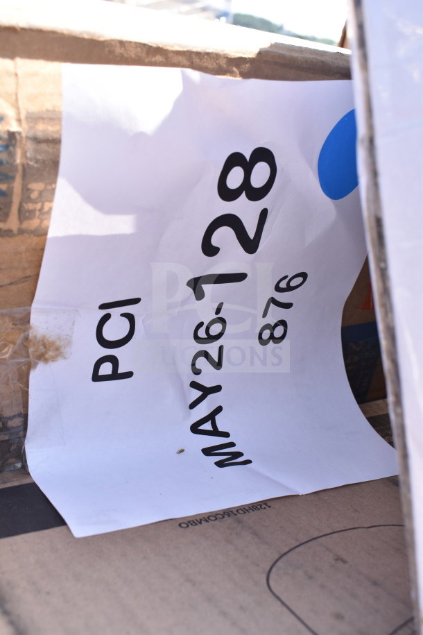 Box with paper label "MAY26-128" and "PCI", containing new scratch and dent items including gloves, napkins, and portion cups.