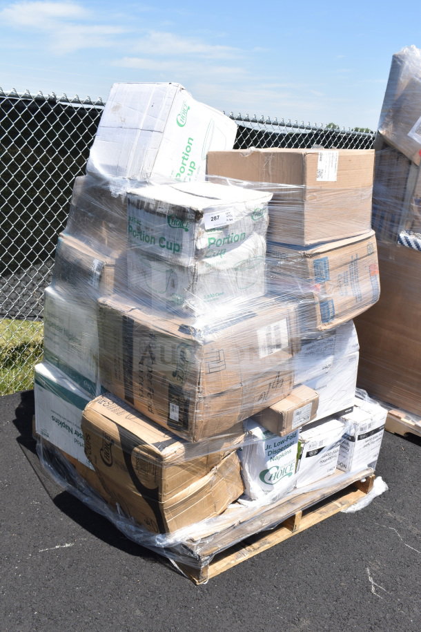 Pallet of 31 brand new scratch and dent items, including gloves, napkins, and portion cups, wrapped in plastic.