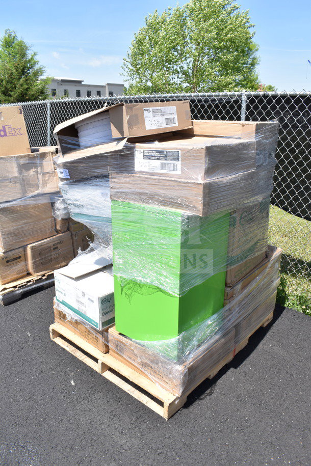 Plastic-wrapped pallet of assorted scratch and dent items including napkins and containers. Mixed brands visible on boxes.