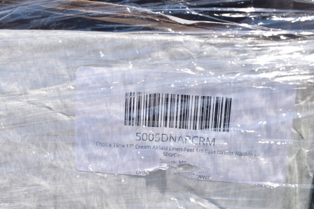 Packaged items labeled "Choice 15x17 Cream Airlaid Linen-Feel 1/8 Fold Dinner Napkin." 500 per case visible on wrapped pallet.
