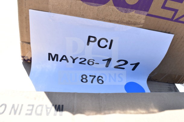 Cardboard box with label "PCI MAY26-121". Contains 31 new scratch and dent items: tea cups, glasses, milk crates.