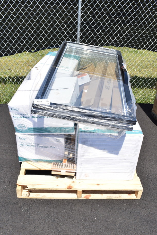 Sealed pallet with glass door, grill cleaning brush, and boxed items in original packaging marked as "scratch and dent."