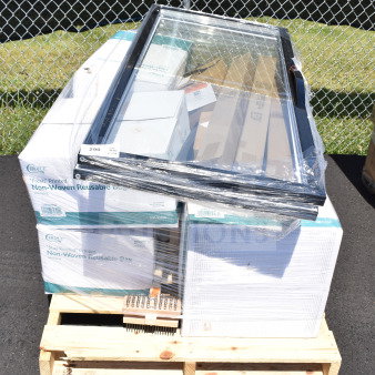 Sealed pallet with glass door, grill cleaning brush, and boxed items in original packaging marked as "scratch and dent."
