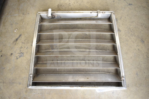 Metal vent cover with horizontal slats, showing signs of wear. Key auction item among a set of five various pieces.