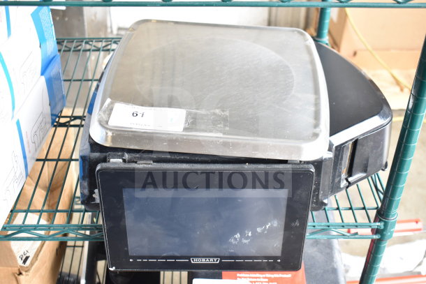 2017 Hobart HTi-7LH26 commercial countertop food portioning scale, front screen inoperative. Model and branding visible.