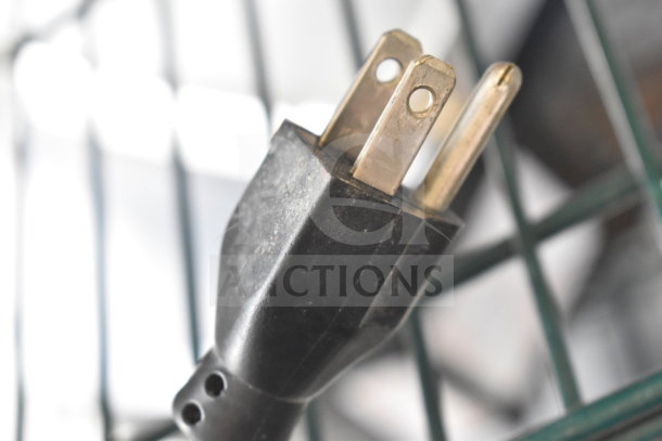Close-up of a black power plug for the 2017 Hobart HTi-7LH26 Commercial Scale, showing slight wear.