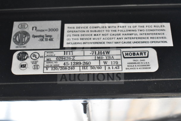 2024 Hobart HTi-7LH4W food portioning scale label showing model info, serial number, and voltage details.