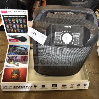 Ion Party Rocker Max speaker on store display with customizable party themes, microphone included, 120 watts power, Bluetooth.
