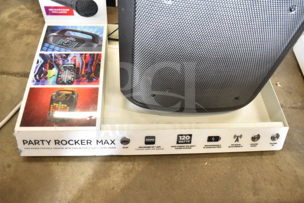 Store display with Ion Party Rocker Max Speaker, featuring a high-power 120-watt sound system and customizable lights.