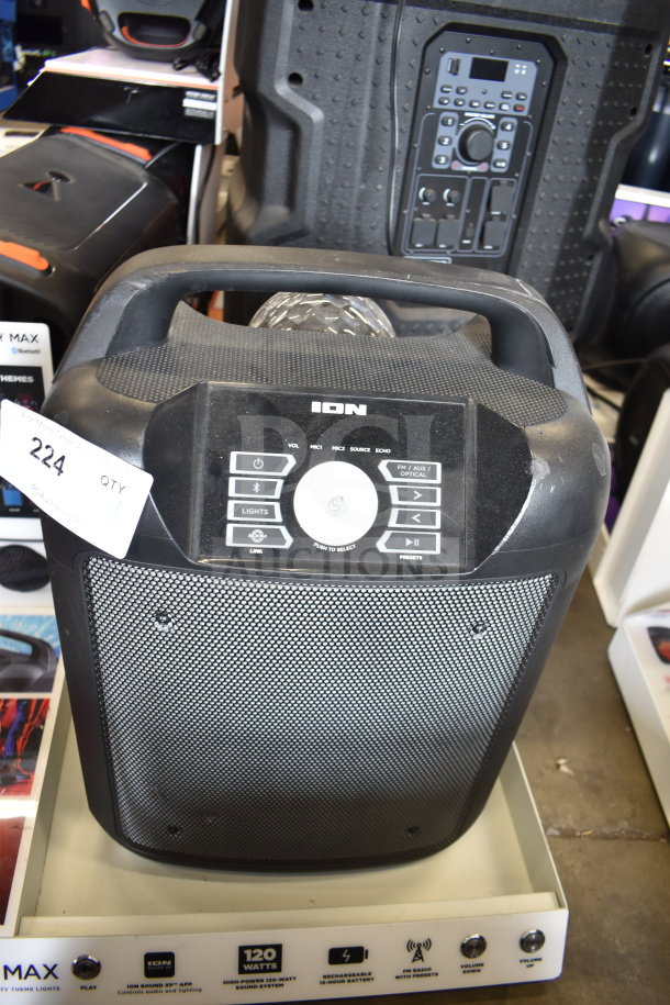 ION Party Rocker Max speaker on display stand, featuring control panel, 120-watt sound, rechargeable battery. Appears in good condition.