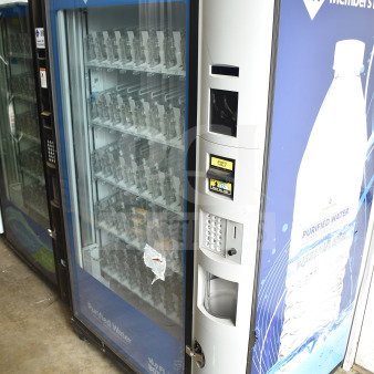 Crane 5800-4 commercial vending machine with bill acceptor, 115 volts, 1 phase. Features two glass display panels.