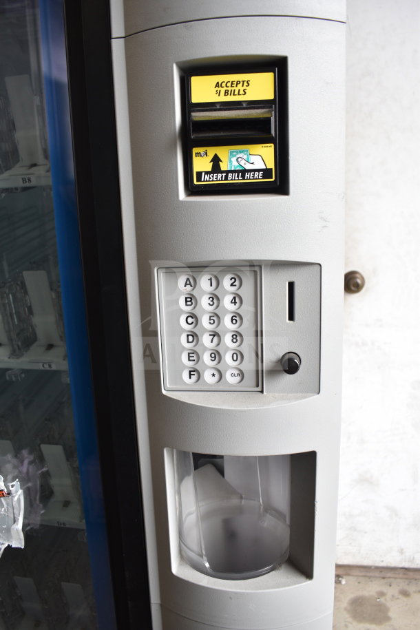 Crane 5800-4 vending machine with bill acceptor, keypad, and can dispenser; accepts $1 bills; commercial use.