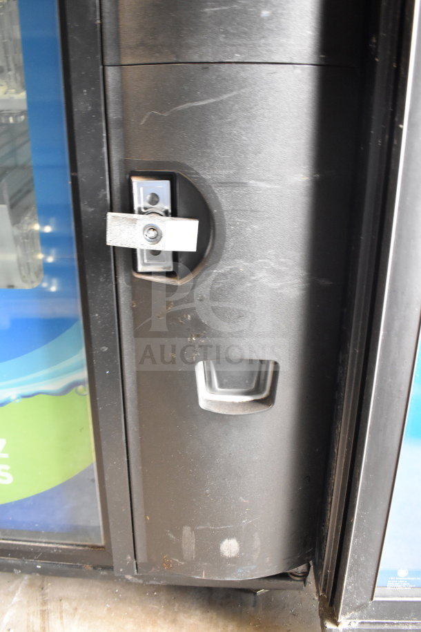 Crane 5800-4 commercial bottled drink vending machine with bill acceptor, 115 volts, 1 phase, in used condition.