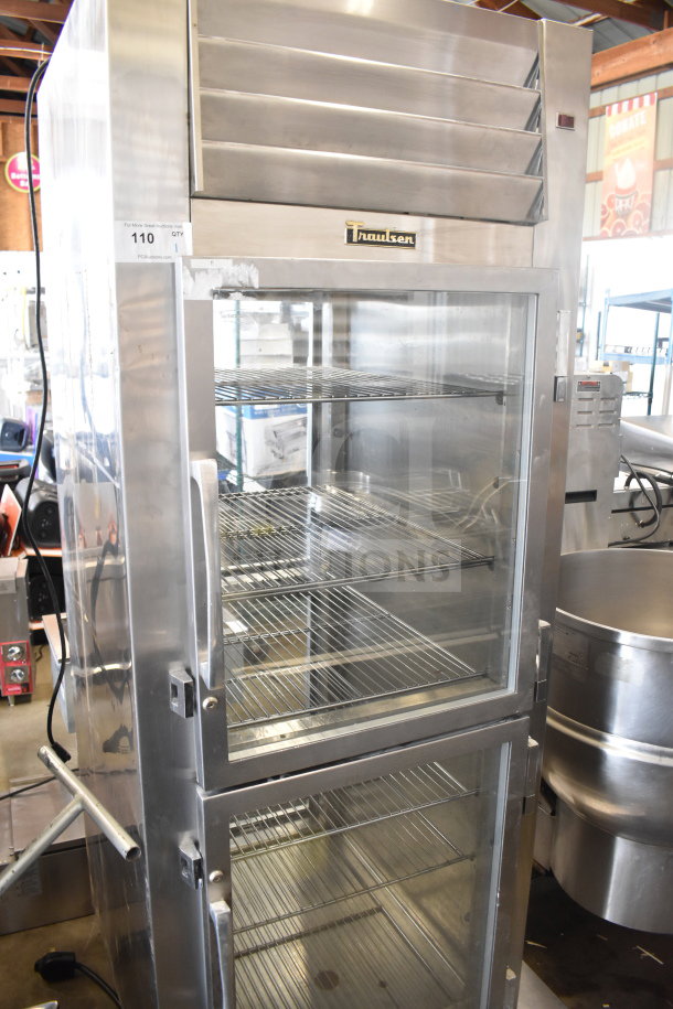 Traulsen RHT132WPTHHG commercial cooler, 2 half-size doors missing, stainless steel, 115V, 1 phase, model tag visible.
