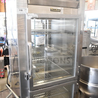 Traulsen RHT132WPTHHG commercial cooler, 2 half-size doors missing, stainless steel, 115V, 1 phase, model tag visible.