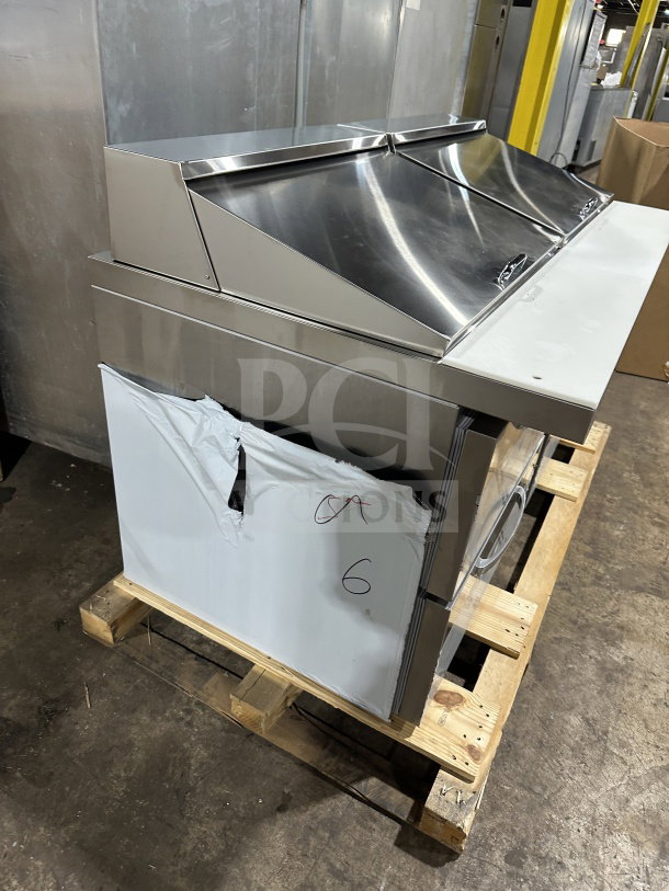 Brand new Continental 60" stainless steel sandwich prep table, model SW602N24MD00. Features include 4 drawers, Mighty Top, on casters.