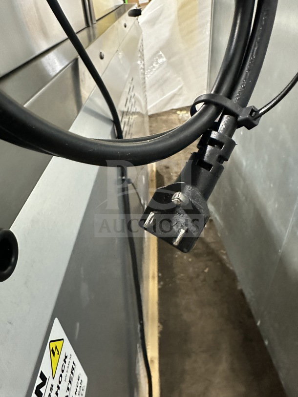 Power cable and plug of a Continental SW602N24MD00 sandwich prep table refrigerator, showing electrical connection details.