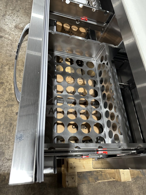 Brand new Continental SW602N24MD00 stainless steel sandwich prep table with 4-drawer shelving; shown open on casters.