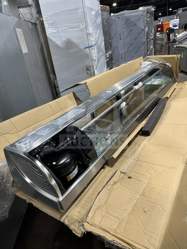 Hoshizaki refrigerated display case, model HNC-210BA-L-SLH, new with scratches. Curved glass, left-side compressor visible.
