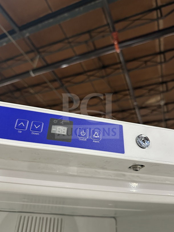 Brand new Liebherr GRB23W1HFC electric refrigerator, digital controls, chrome rack, model SN: 838215126, 115V, on legs.